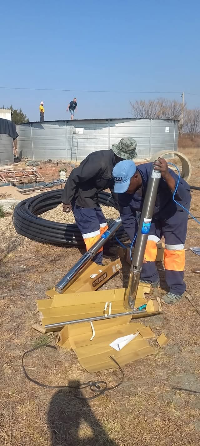 BoreFixPro technicians preparing a Speroni submersible pump for installation at an agricultural site in Gauteng